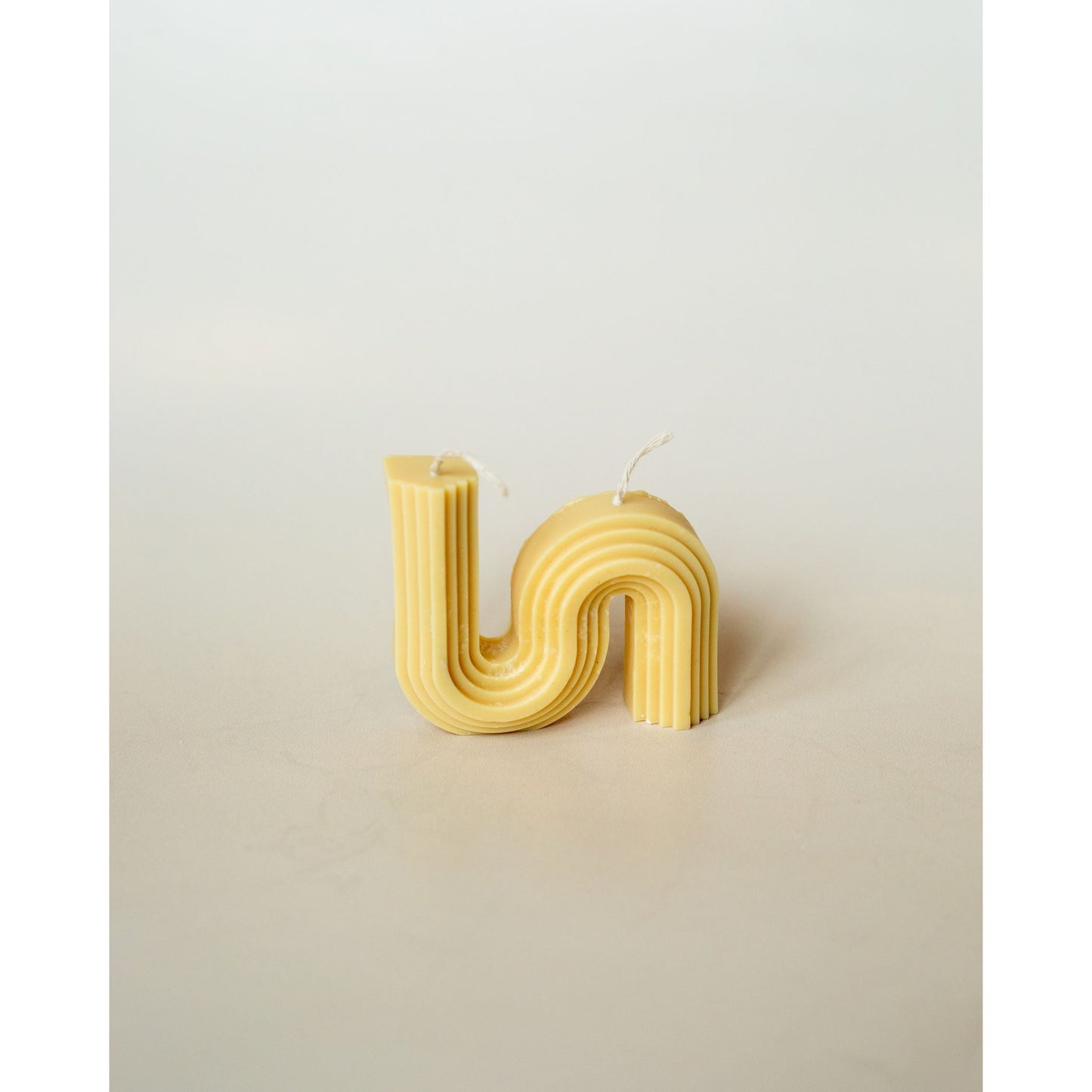 The Double Wick Snake Candle Image in Yellow