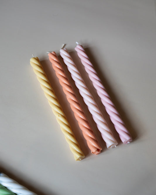 Suki Home Swirl Pillar Candles in multiple pastel colours.