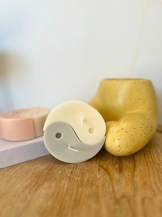 Three soap bars on a wooden surface with a blurred background