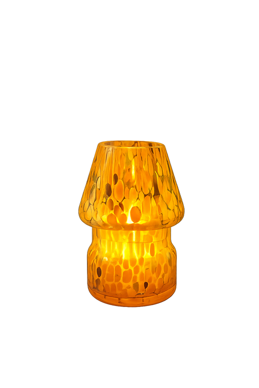 Orange textured mini mushroom candle lamp on a white background